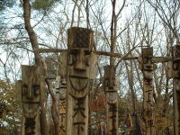 At a traditional village, carved guardians.