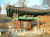 Temple bell in frosty morning light.